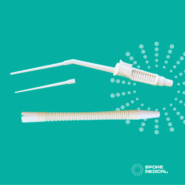 Zephyr single-use microsuction device with two tips and a flexible single-use adapter tube, laid out on a teal background